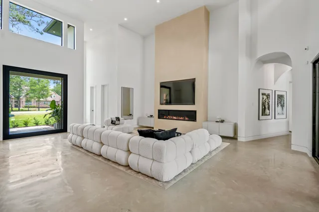 a bedroom with furniture and a flat screen tv