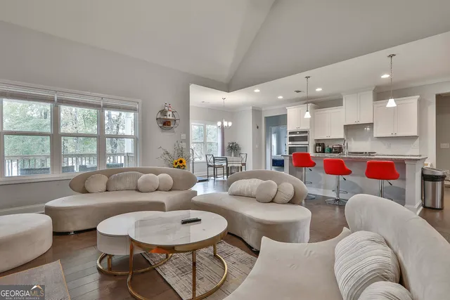 a kitchen with stainless steel appliances granite countertop a stove refrigerator and cabinets