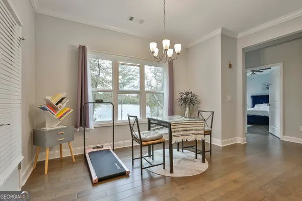 a view of a livingroom with furniture window and wooden floor