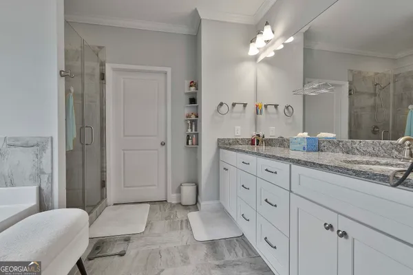 a bathroom with a bathtub and shower