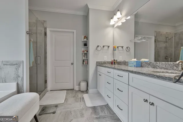 a bathroom with a bathtub and shower