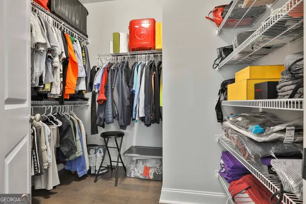 a bedroom with a bed chair and a window