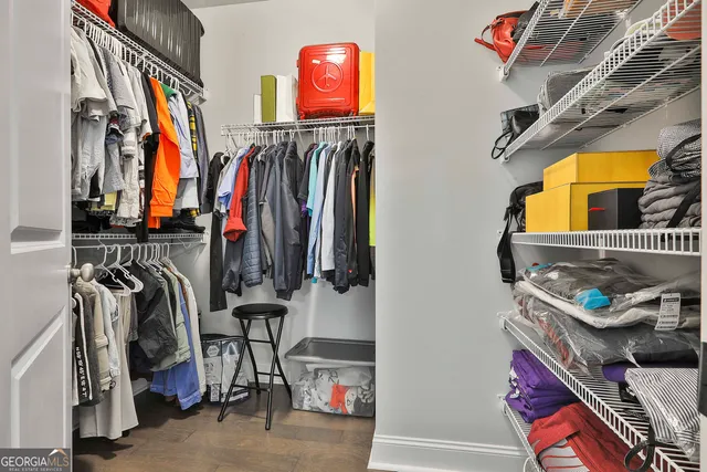 a bedroom with a bed chair and a window