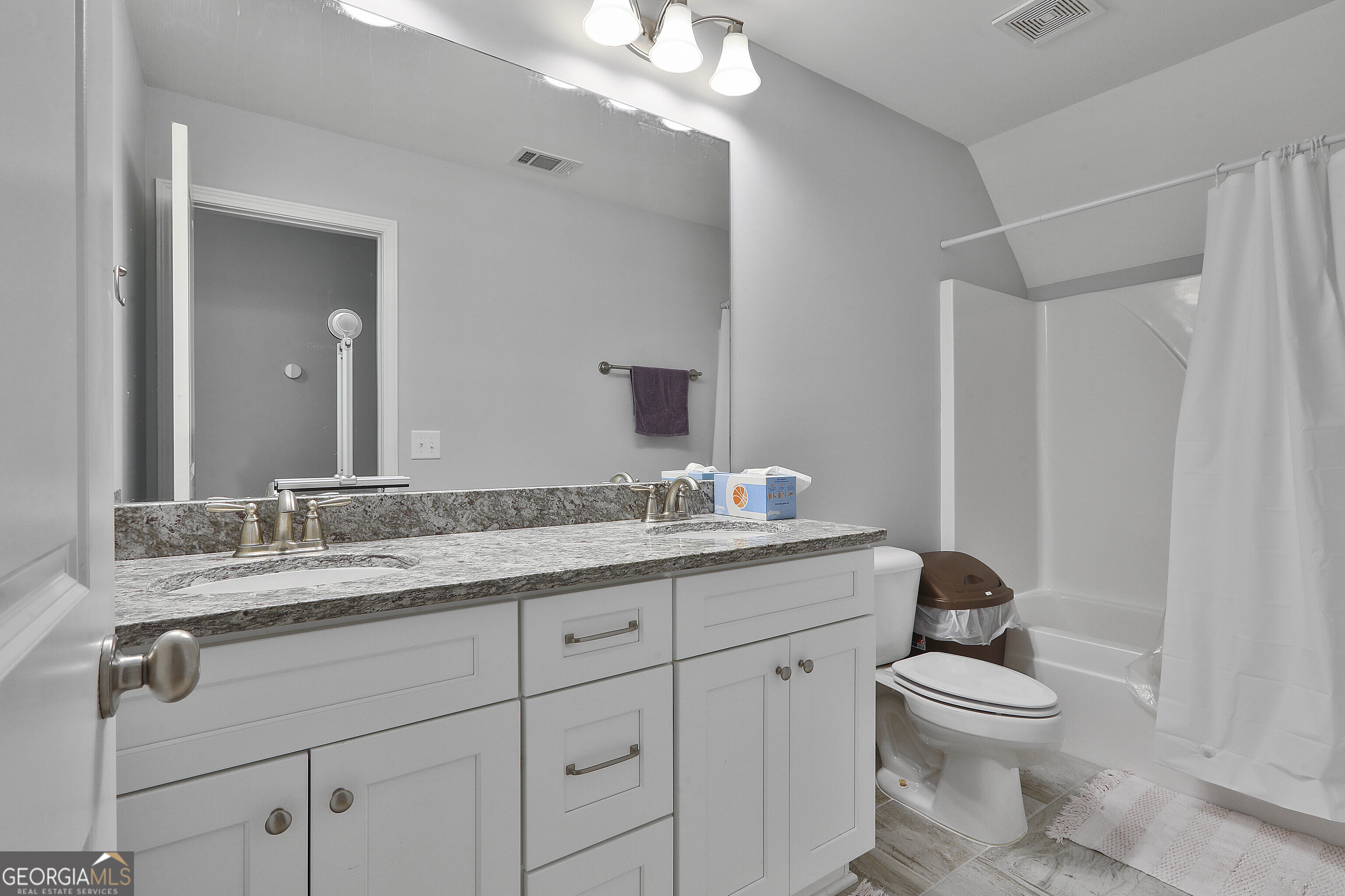 405 Lakeview Way LaGrange, GA 30241 - Photo 26 of 54 a bathroom with a granite countertop toilet sink and mirror