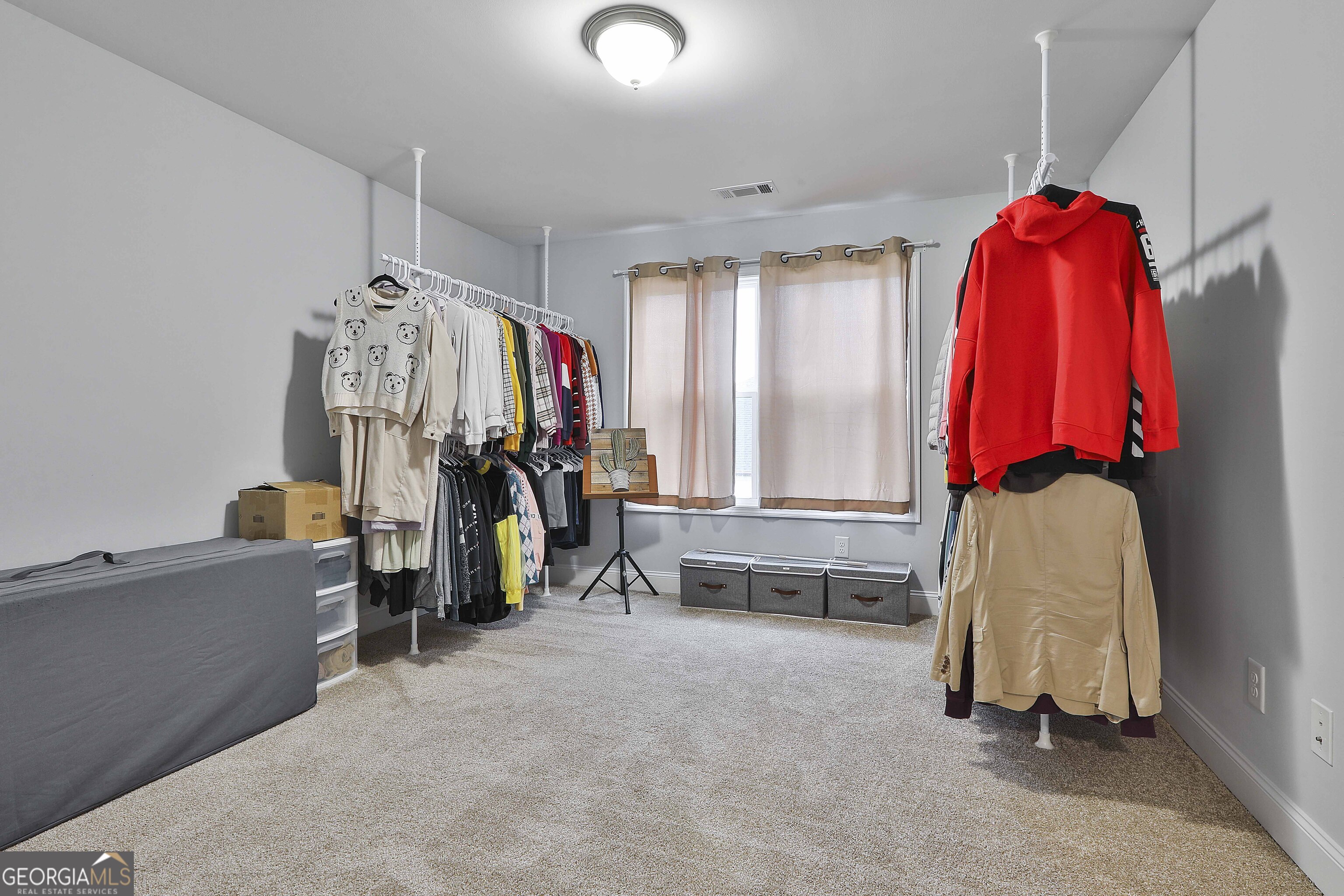 405 Lakeview Way LaGrange, GA 30241 - Photo 28 of 54 a view of walk in closet with clothes and shoes