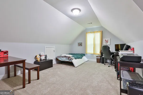 a view of livingroom with furniture and windows