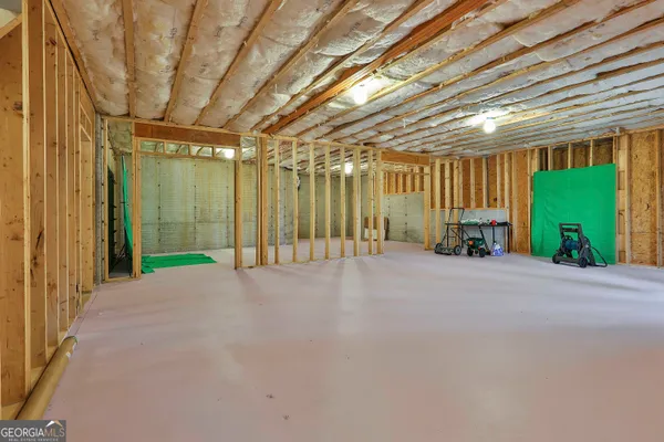 a view of an empty room with windows