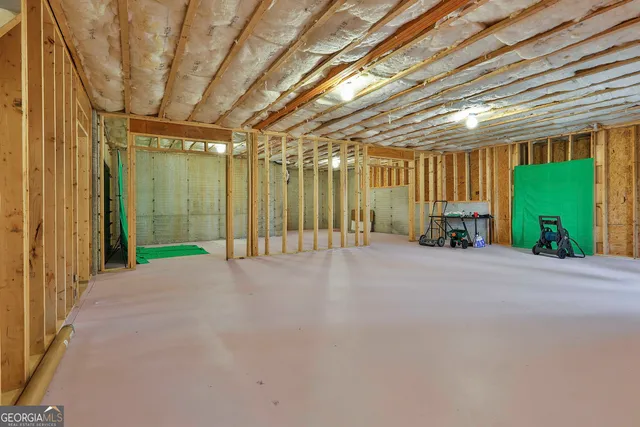 a view of an empty room with windows