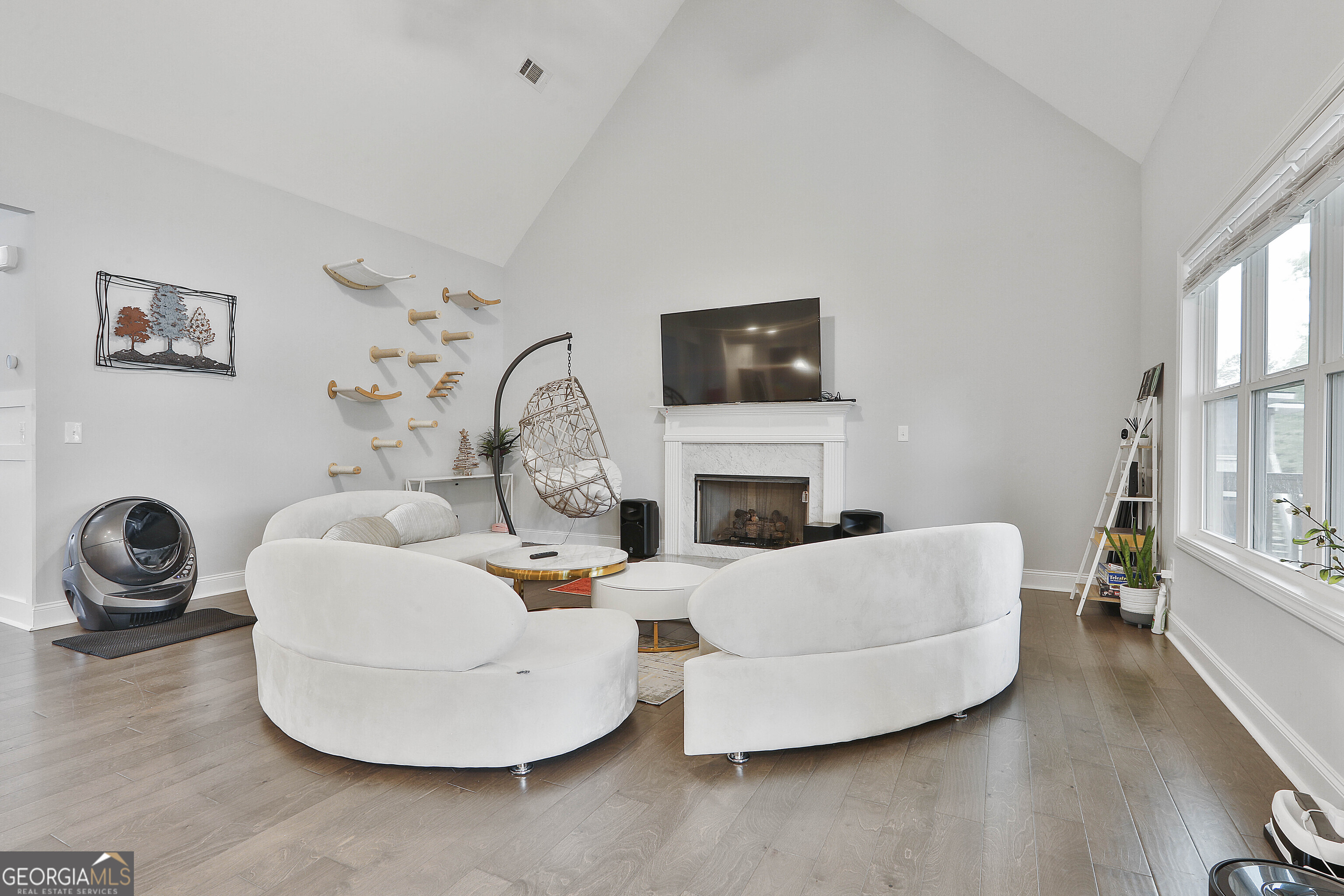 405 Lakeview Way LaGrange, GA 30241 - Photo 10 of 54 a living room with furniture a fireplace and a flat screen tv
