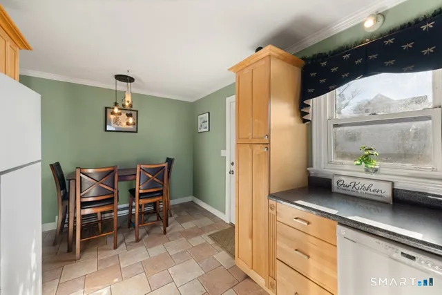 a kitchen with a table and chairs in it