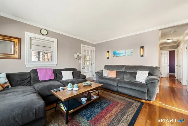 a living room with furniture and a rug