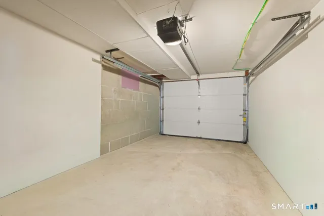 an aerial view of a house with a garden and lake view