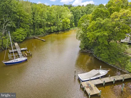 an aerial view of a house with a lake view