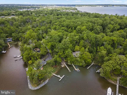 an aerial view of a houses with a yard