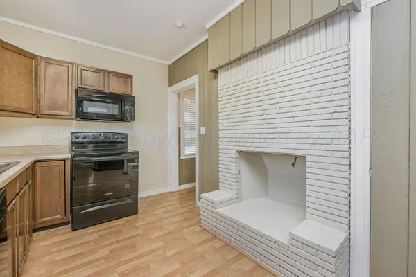 a kitchen with a stove and a microwave