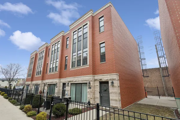 a front view of a building with glass windows