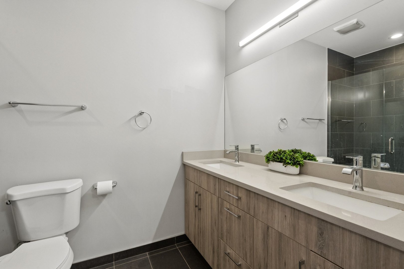2237 West Coulter Street, Unit 4 Chicago, IL 60608 - Photo 14 of 26 a bathroom with a sink and mirror with toilet