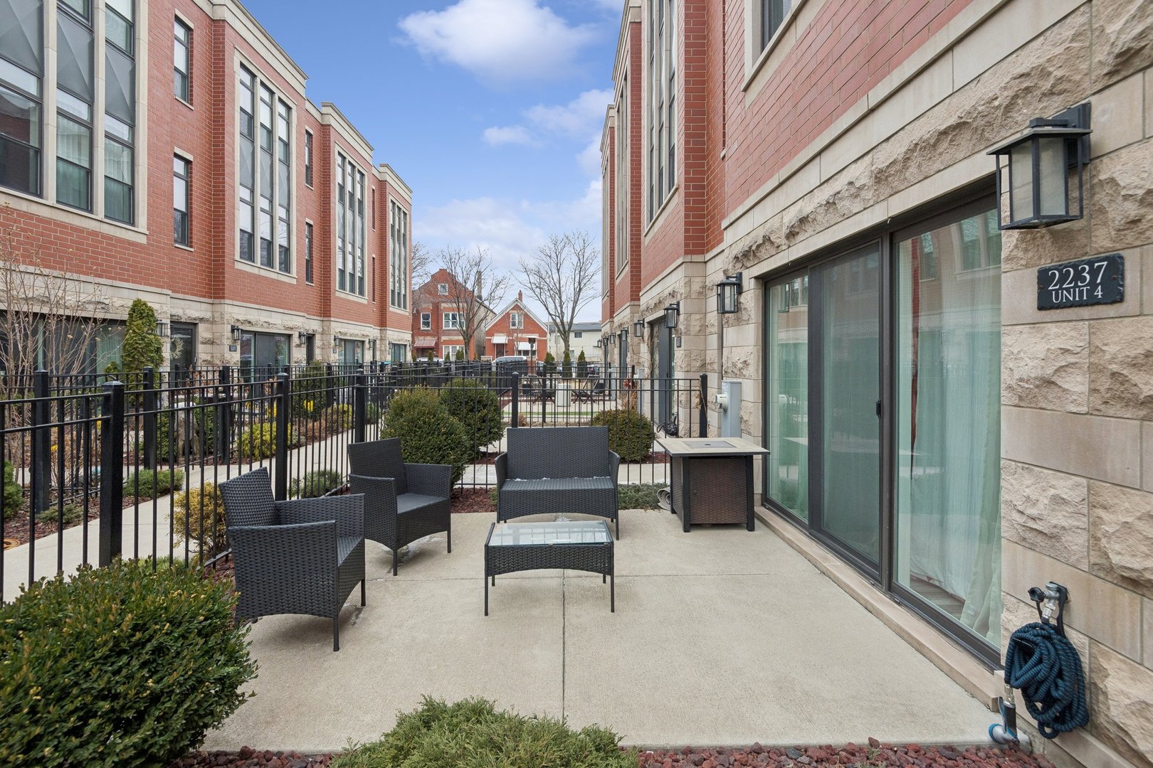 2237 West Coulter Street, Unit 4 Chicago, IL 60608 - Photo 20 of 26 a building outdoor space with patio furniture and potted plants