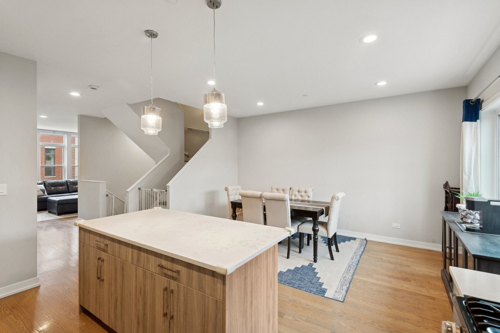 2237 West Coulter Street, Unit 4 Chicago, IL 60608 - Photo 4 of 26 a kitchen with a table and chairs