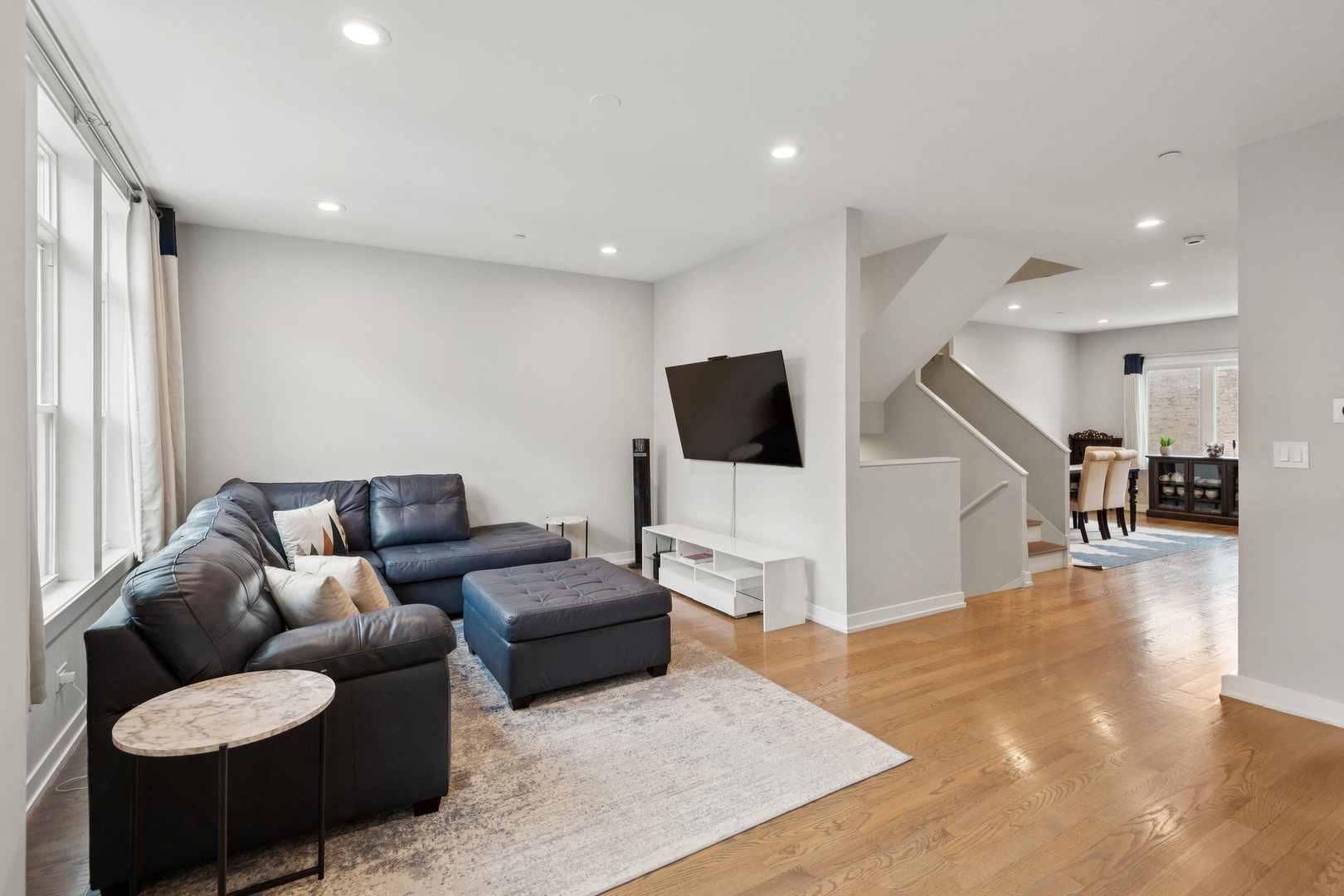 2237 West Coulter Street, Unit 4 Chicago, IL 60608 - Photo 8 of 26 a living room with furniture and a flat screen tv