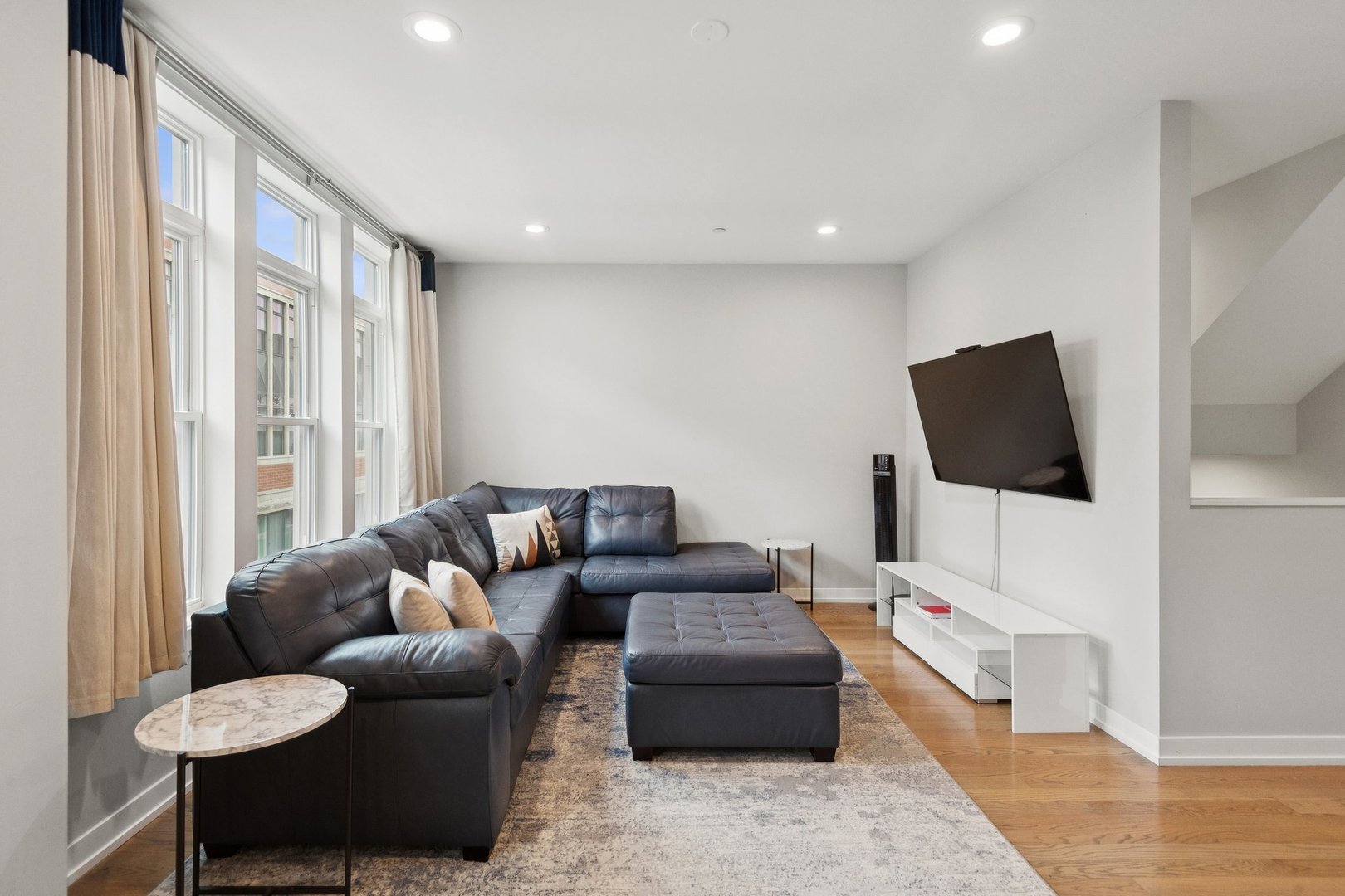 2237 West Coulter Street, Unit 4 Chicago, IL 60608 - Photo 10 of 26 a living room with furniture and a flat screen tv