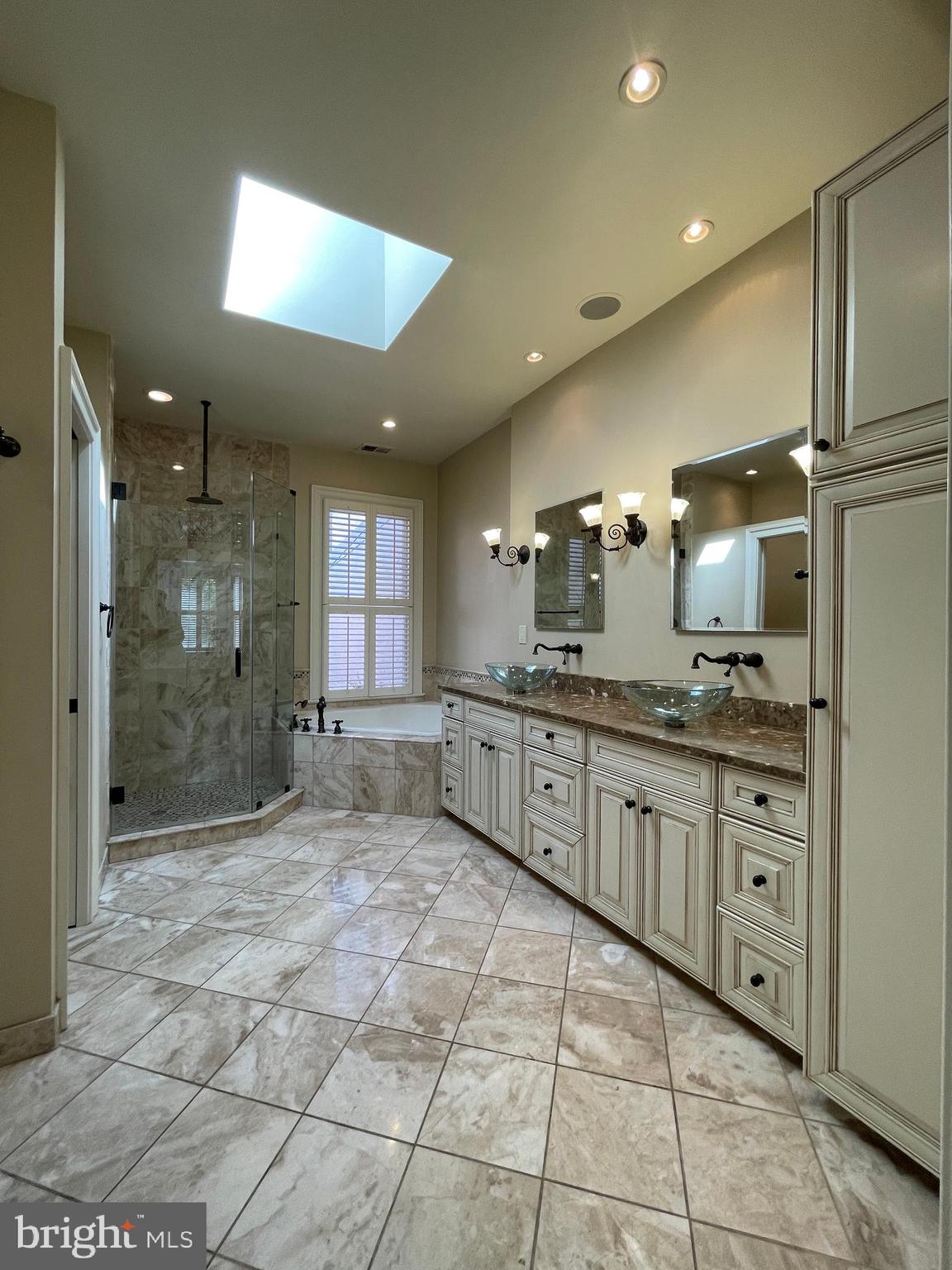 614 A Street Northeast Washington, DC 20002 - Photo 22 of 48 a large bathroom with a granite countertop sink mirror and shower