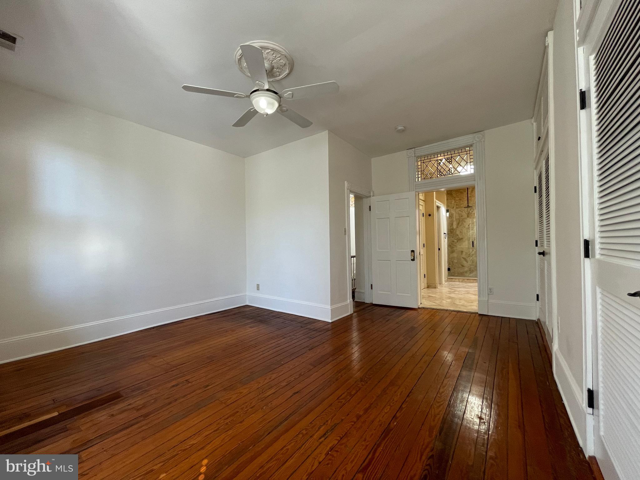 614 A Street Northeast Washington, DC 20002 - Photo 23 of 48 wooden floor in an empty room with a window