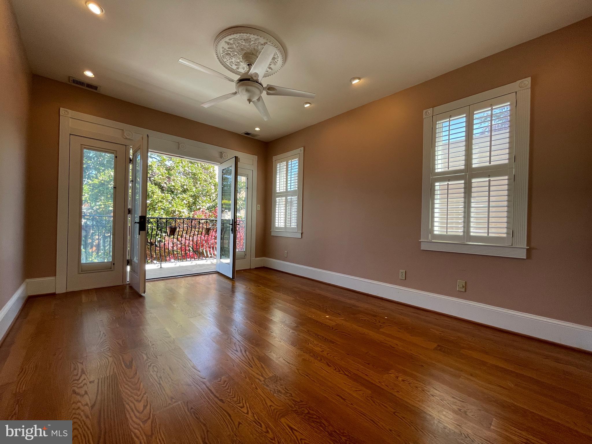 614 A Street Northeast Washington, DC 20002 - Photo 29 of 48 a view of an empty room with wooden floor and a window