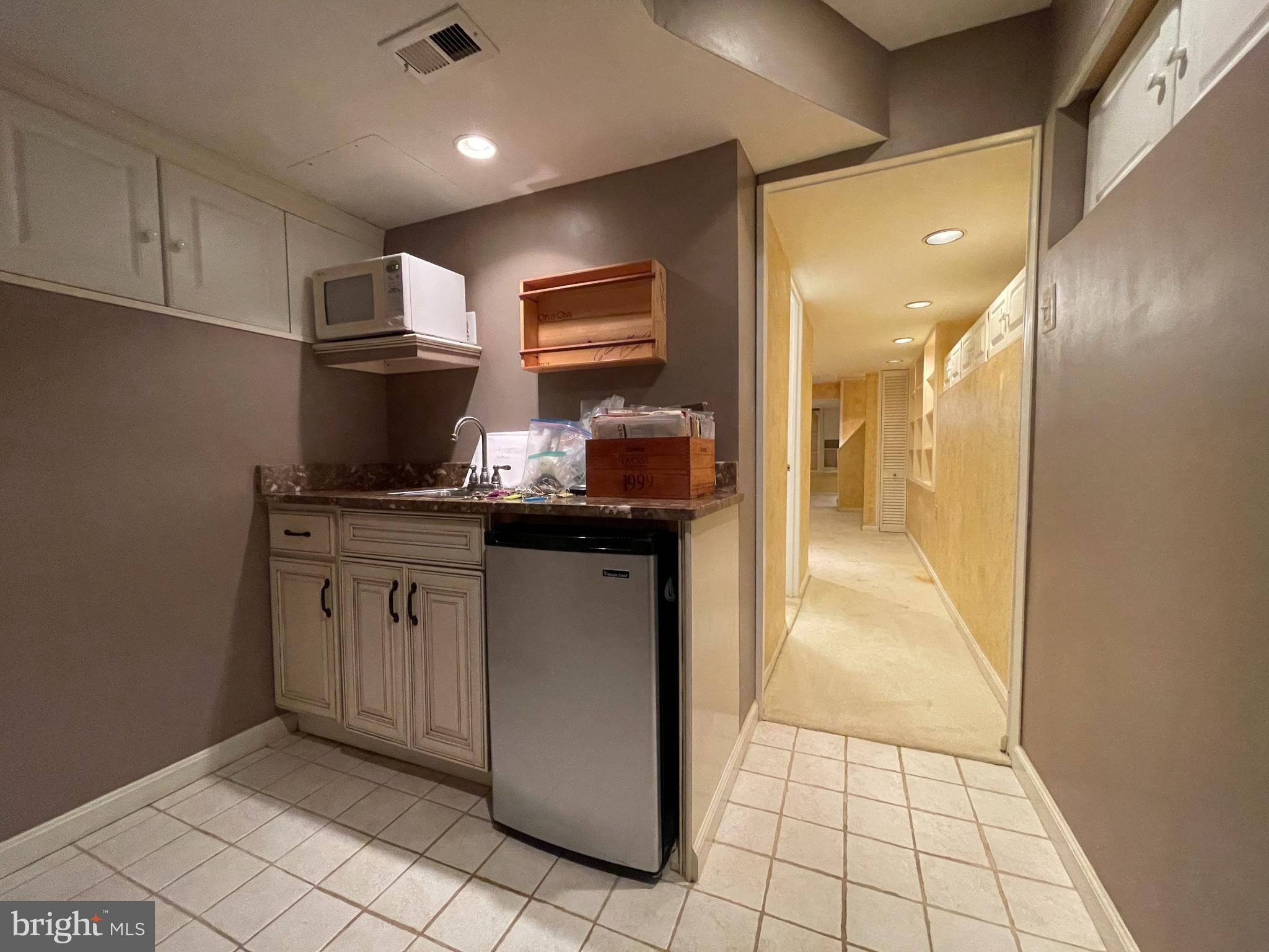 614 A Street Northeast Washington, DC 20002 - Photo 35 of 48 a kitchen with stainless steel appliances granite countertop a sink and cabinets