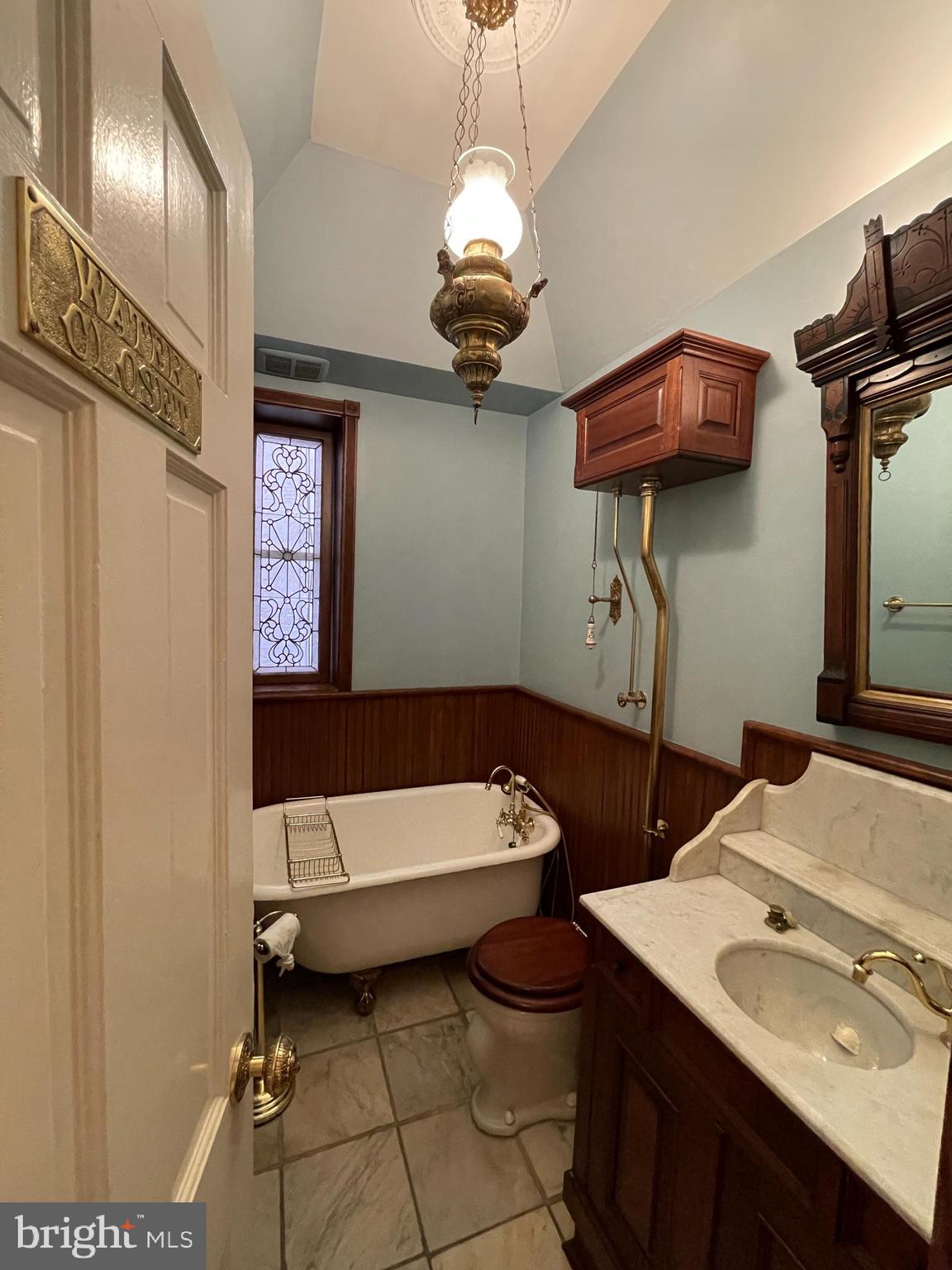 614 A Street Northeast Washington, DC 20002 - Photo 6 of 48 a bathroom with a sink a toilet and mirror