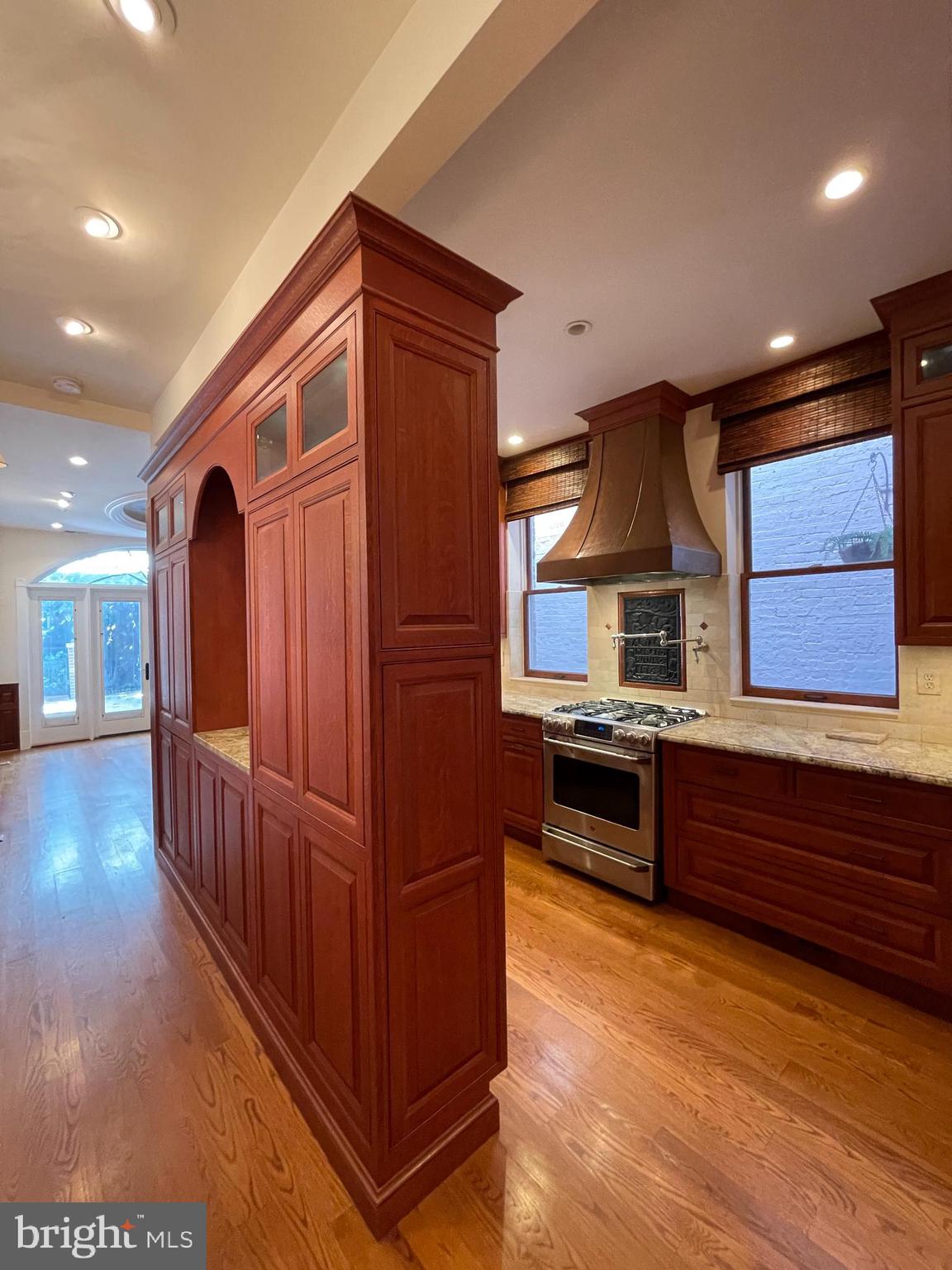 614 A Street Northeast Washington, DC 20002 - Photo 10 of 48 a kitchen with stainless steel appliances granite countertop a stove and a sink