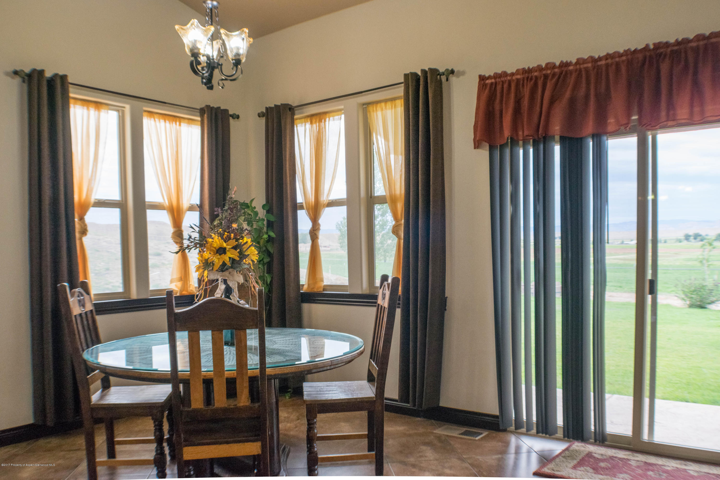 1690 8 Road Mack, CO 81525 - Photo 12 of 37 a view of a dining room with furniture and window