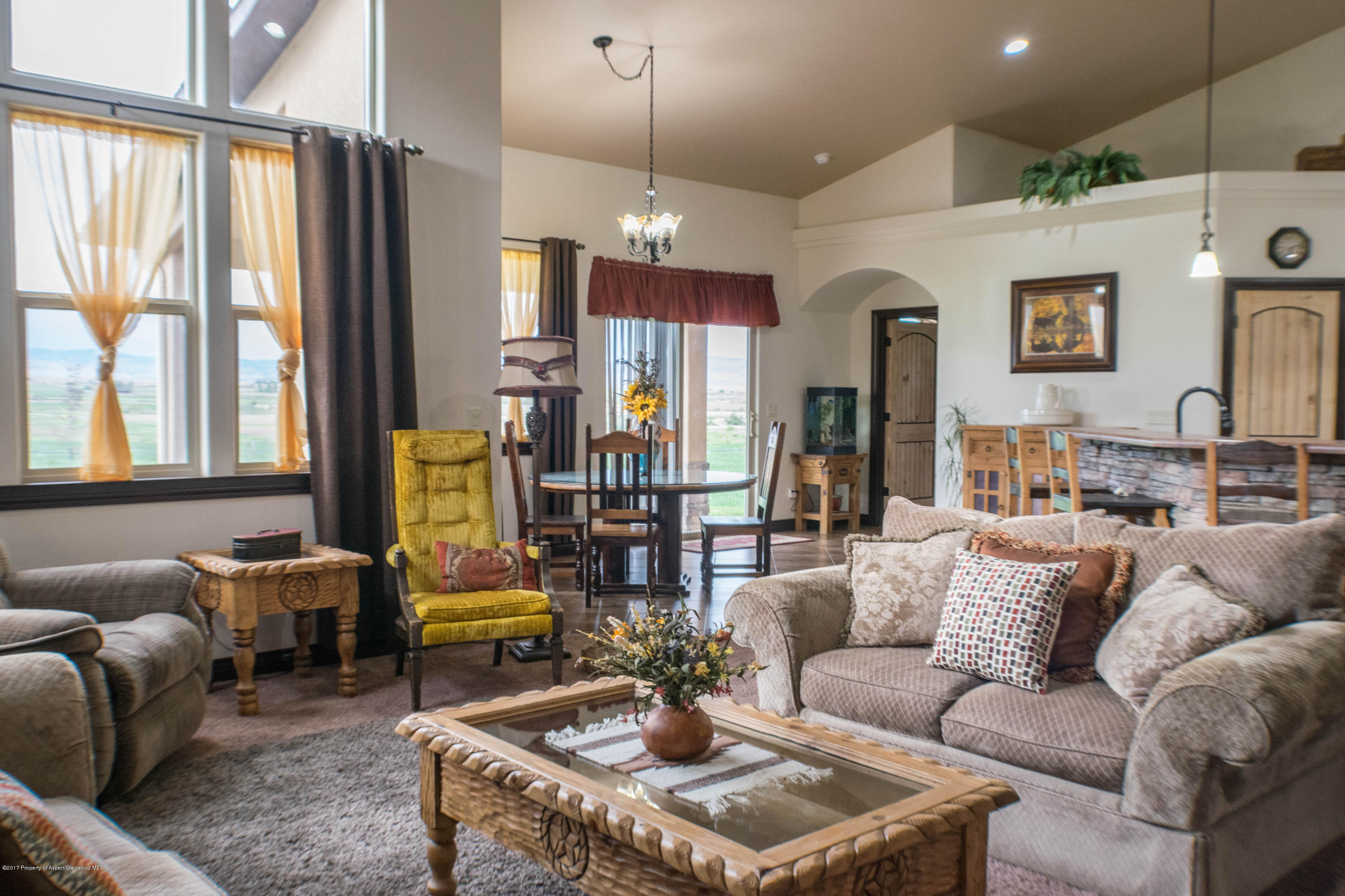 1690 8 Road Mack, CO 81525 - Photo 14 of 37 a living room with furniture and a large window