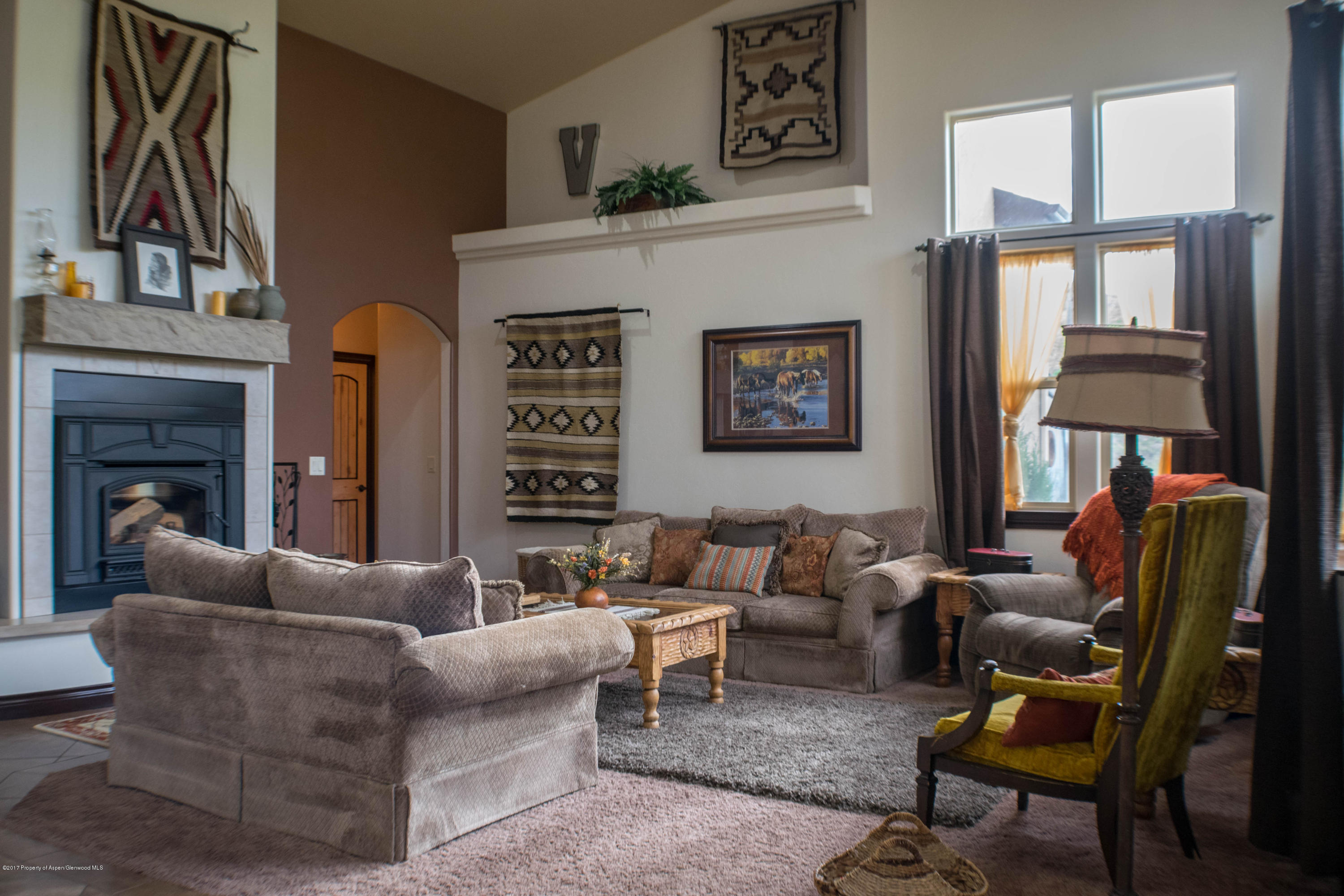 1690 8 Road Mack, CO 81525 - Photo 16 of 37 a living room with furniture and a fireplace