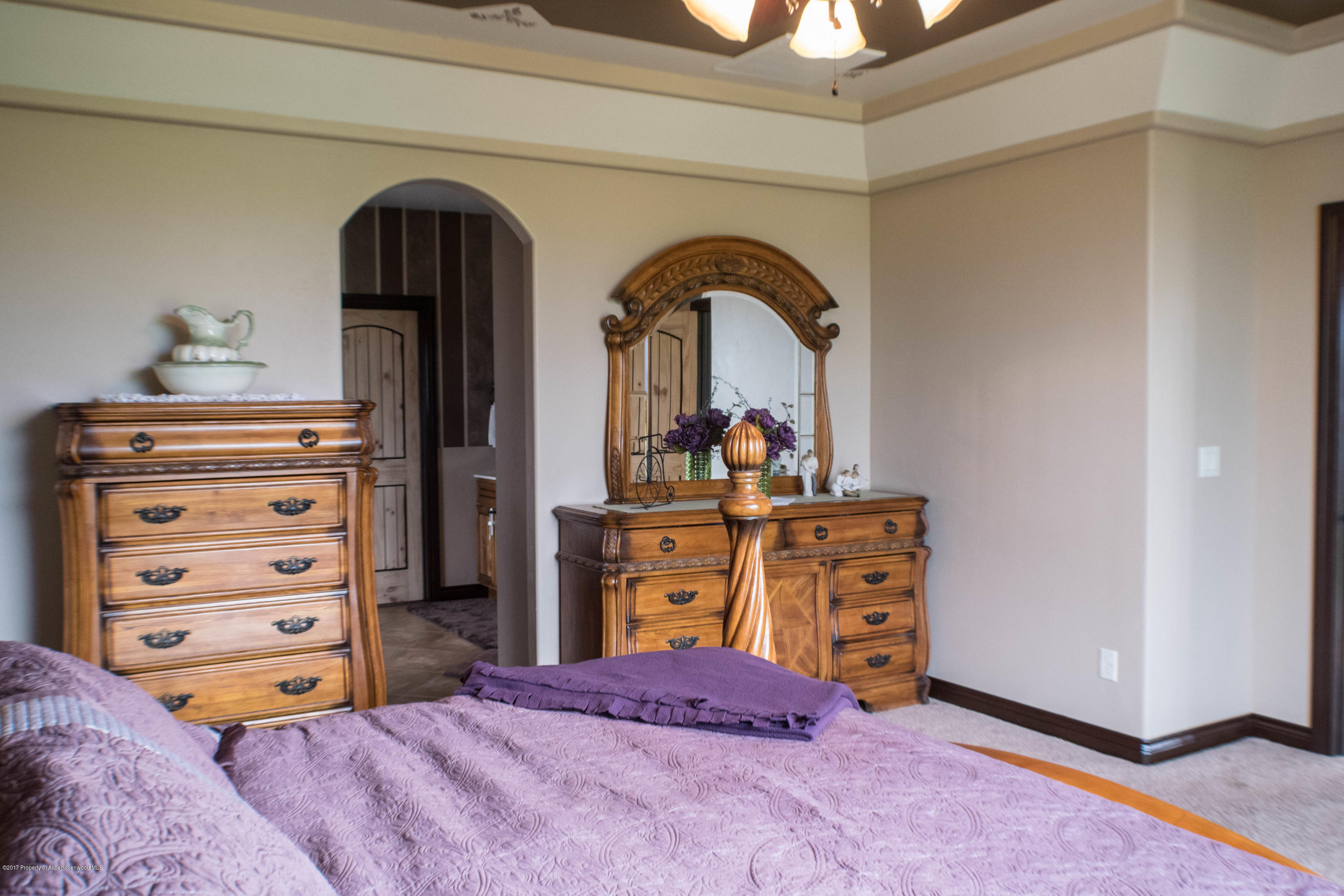 1690 8 Road Mack, CO 81525 - Photo 18 of 37 a bed room with a bed and a dresser