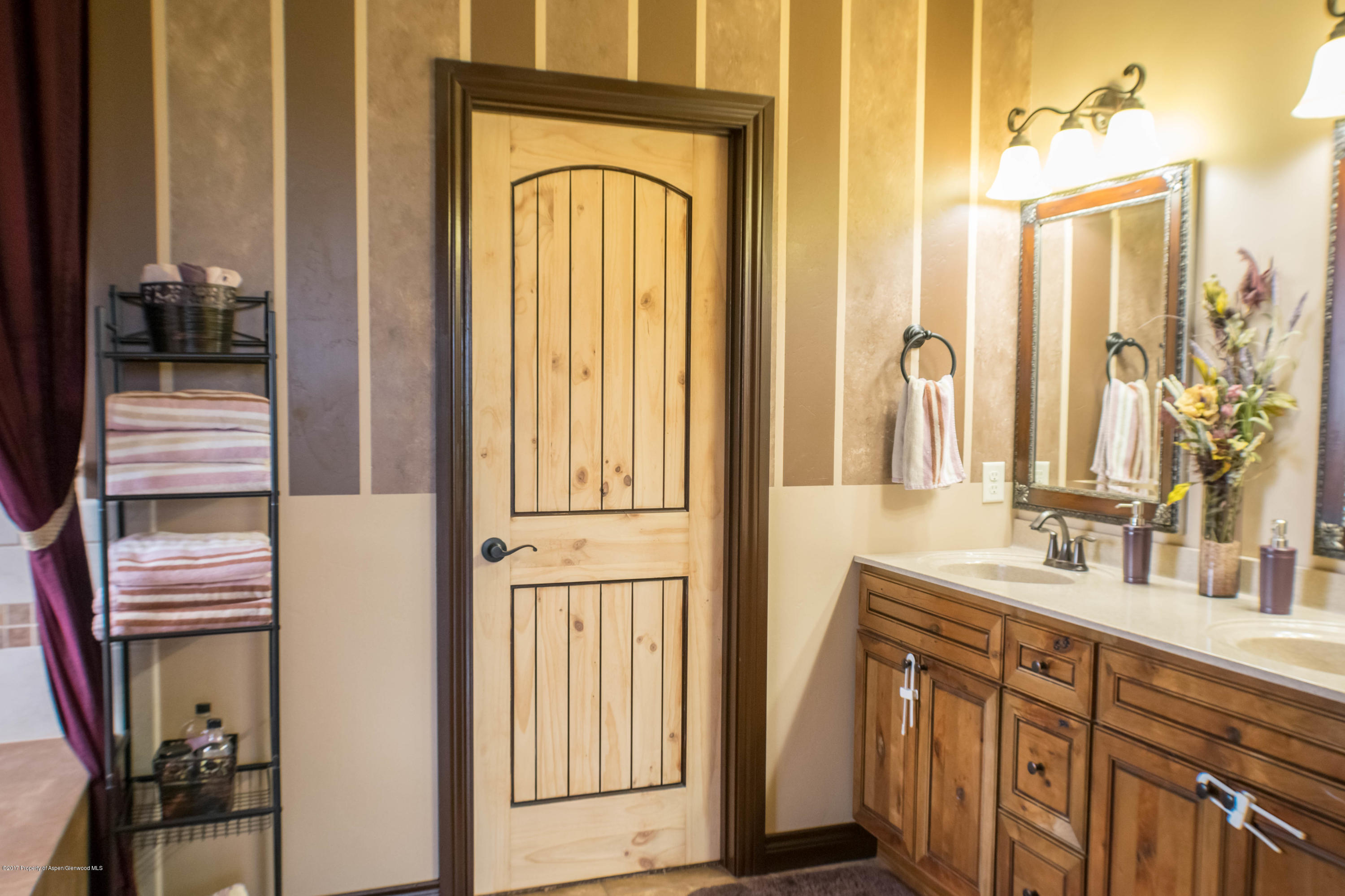 1690 8 Road Mack, CO 81525 - Photo 19 of 37 a bathroom with a sink a mirror and shower