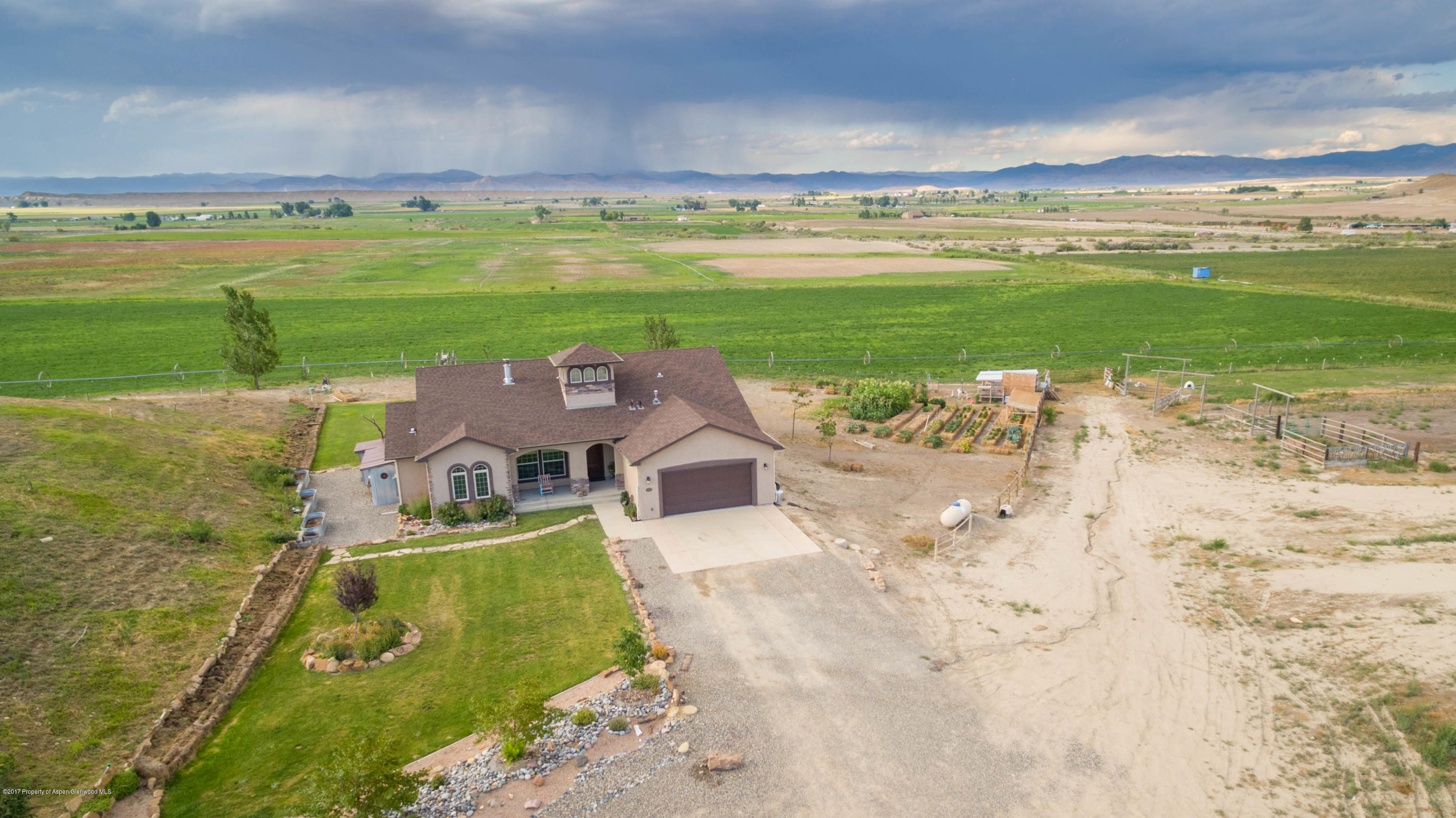 1690 8 Road Mack, CO 81525 - Photo 2 of 37 an aerial view of a house with a garden