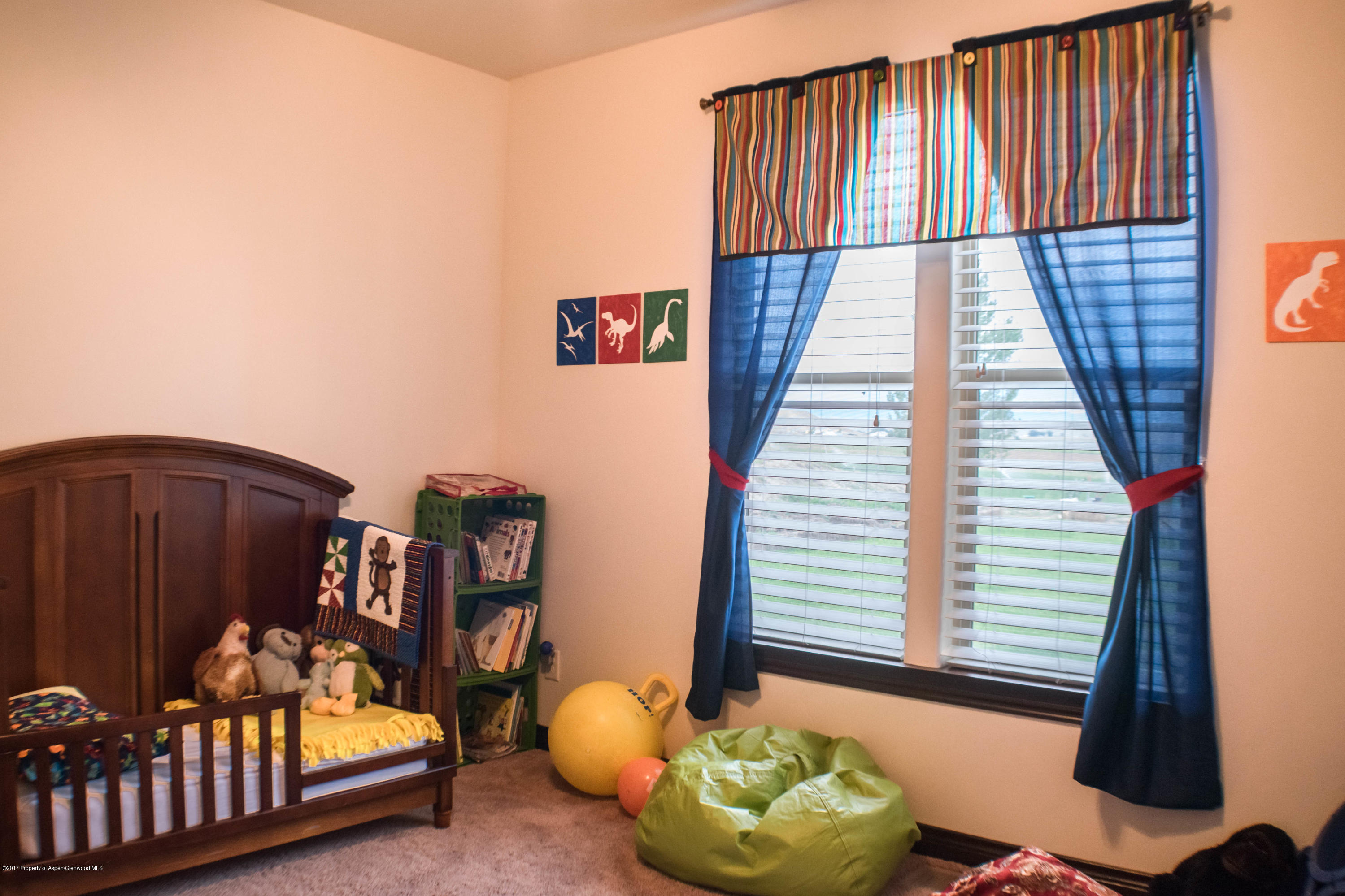 1690 8 Road Mack, CO 81525 - Photo 24 of 37 a bedroom with furniture and a window