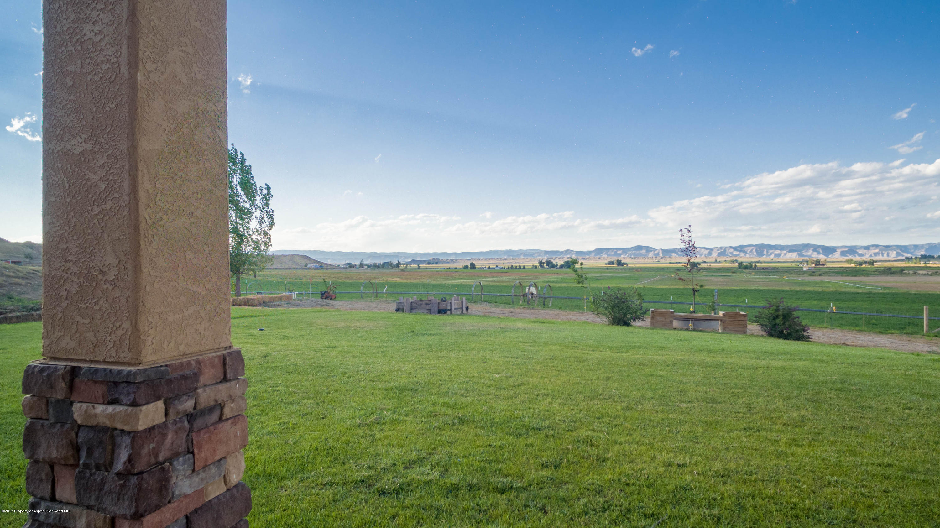 1690 8 Road Mack, CO 81525 - Photo 27 of 37 a view of a green field with clear sky