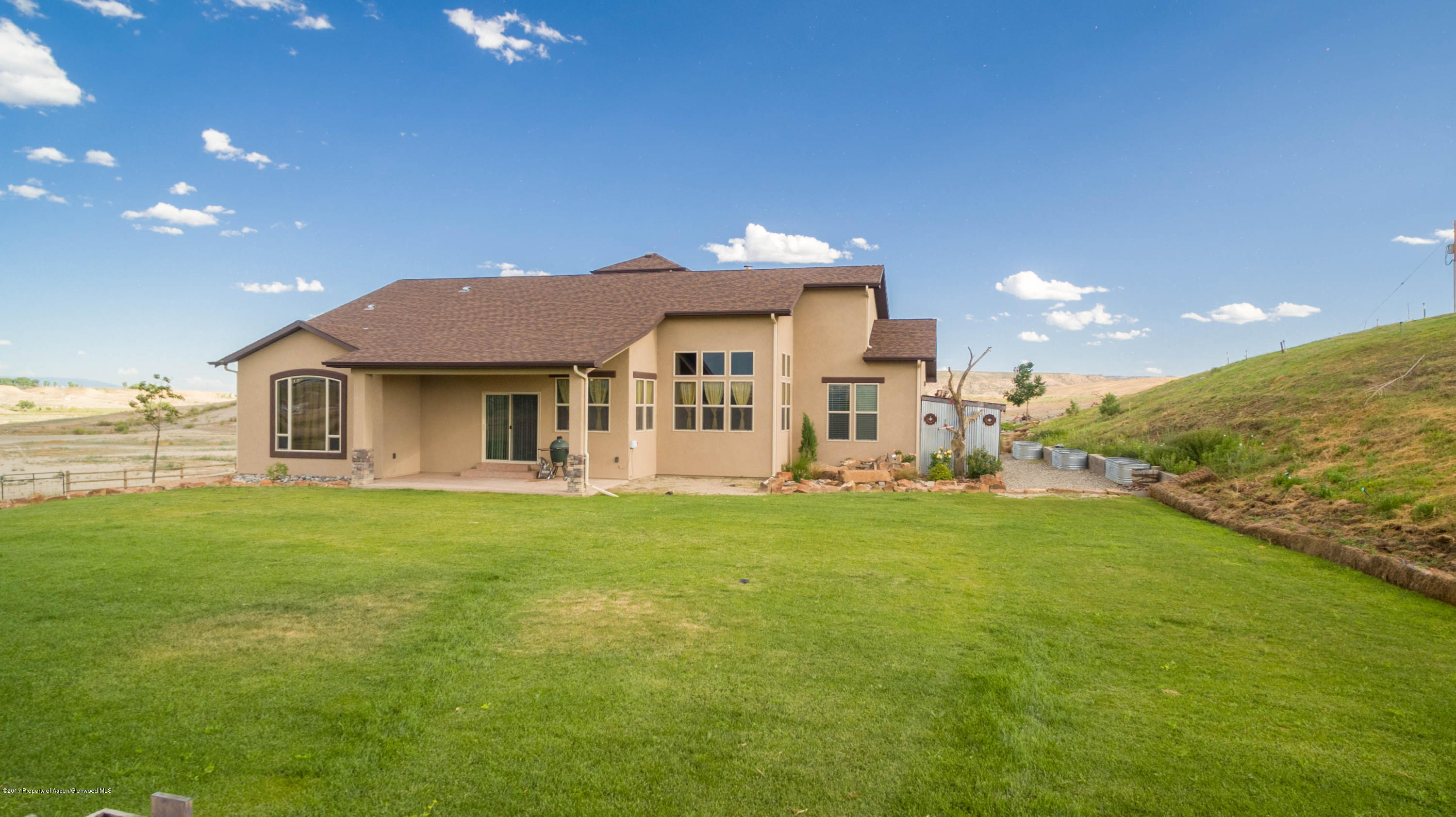1690 8 Road Mack, CO 81525 - Photo 31 of 37 a front view of a house with a garden