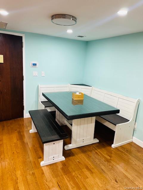 190 Schofield Street, Unit 2E Bronx, NY 10464 - Photo 15 of 24 a living room with a table