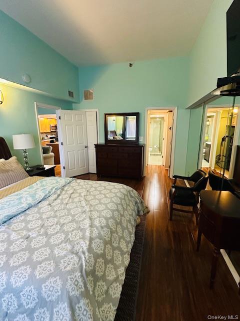 190 Schofield Street, Unit 2E Bronx, NY 10464 - Photo 19 of 24 a bedroom with a bed and wooden floor