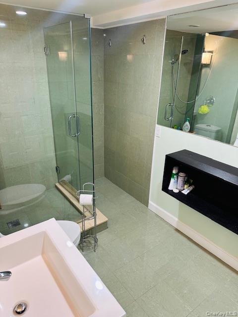 190 Schofield Street, Unit 2E Bronx, NY 10464 - Photo 22 of 24 a bathroom with a sink and a mirror