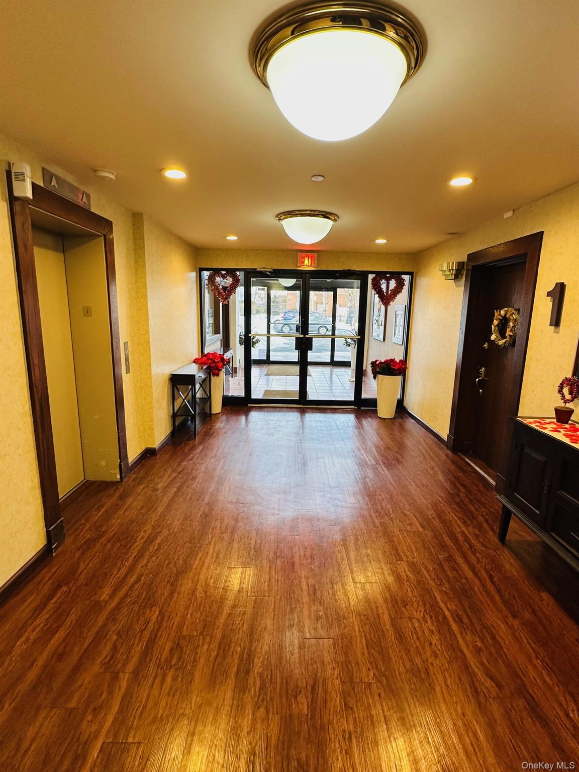 190 Schofield Street, Unit 2E Bronx, NY 10464 - Photo 9 of 24 a view of a livingroom with furniture hardwood floor and a ceiling fan