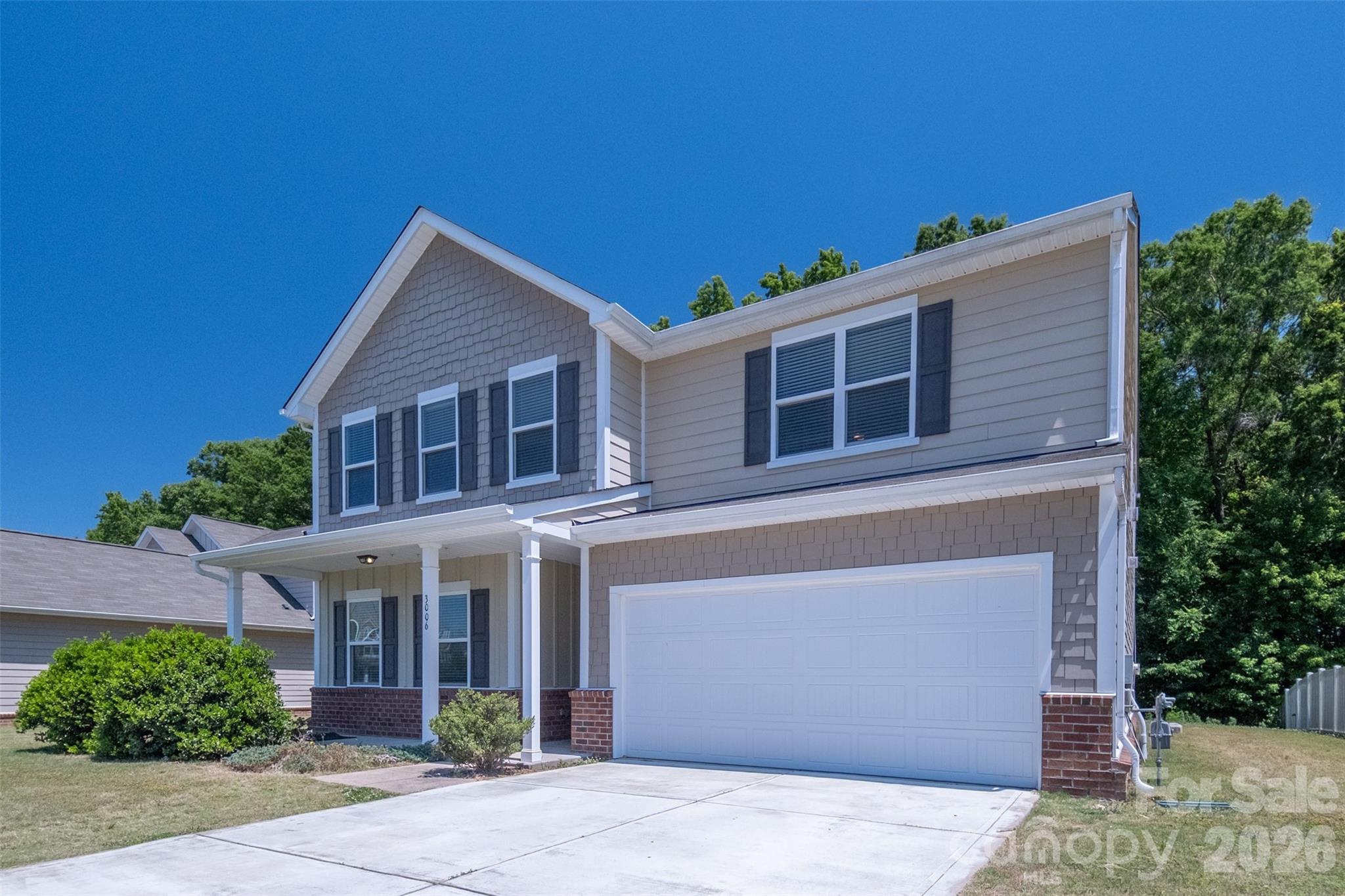 3006 Houndscroft Road Indian Trail, NC 28079 - Photo 2 of 39 a front view of a house with garden