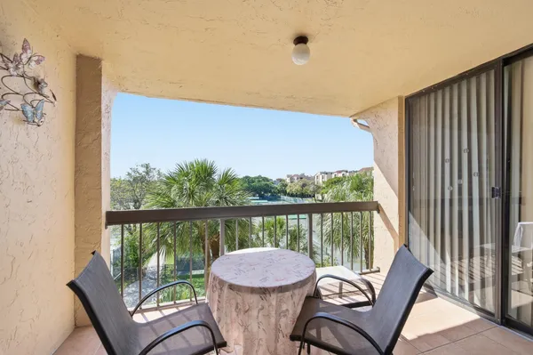 a view of a chair and table in the balcony