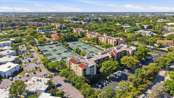 an aerial view of residential houses with outdoor space