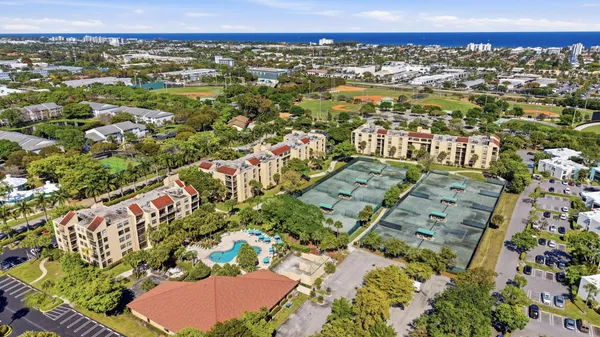 an aerial view of residential houses with outdoor space