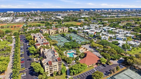 an aerial view of residential houses with outdoor space