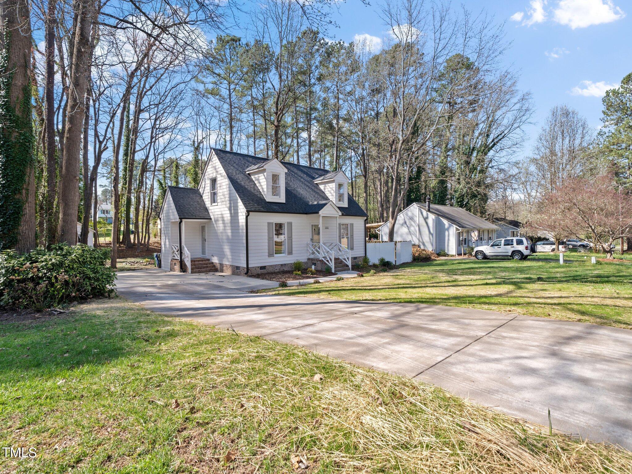 3512 Donna Road Raleigh, NC 27604 - Photo 1 of 28 a view of swimming pool with lawn chairs and large trees